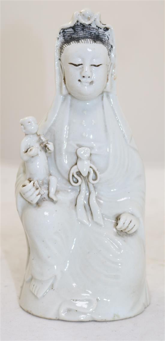 Chinese white glazed porcelain figure of Guanyin holding a child, Jiaqing period, 21cm, childs head re-stuck(-)